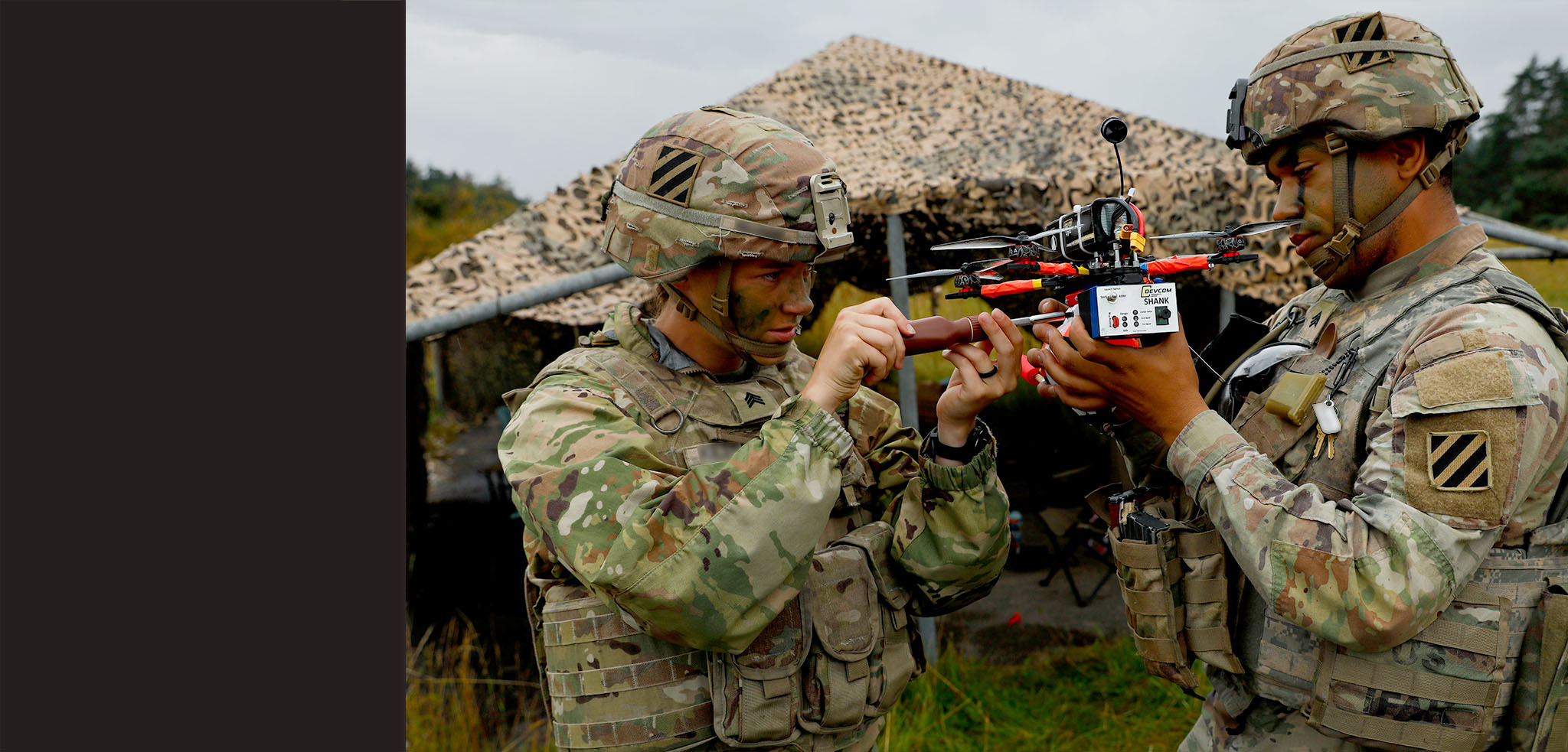 2 Soldiers repairing quadcopter drone