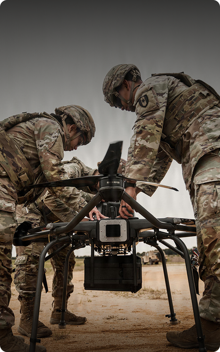 Soldiers holding drone